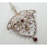 A yellow and white metal, ruby and diamond cluster set drop pendant brooch, 49mm, on an 18ct gold