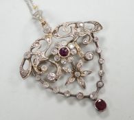 A yellow and white metal, ruby and diamond cluster set drop pendant brooch, 49mm, on an 18ct gold