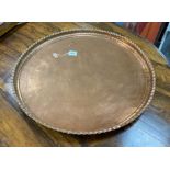 A large circular copper tray, diameter 74cm