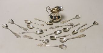 A silver cream jug and sundry minor spoons and forks.