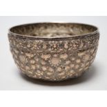 A Chinese Straits? embossed white metal bowl, indistinct marks to the base, diameter 13.9cm, 4.8oz.