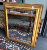 A 19th century rectangular giltwood and composition wall mirror with later plate, width 95cm, height