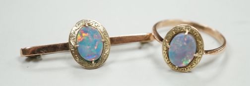 A 9ct and black opal doublet set bar brooch, 38mm and a matching ring, size R, gross weight 5.9