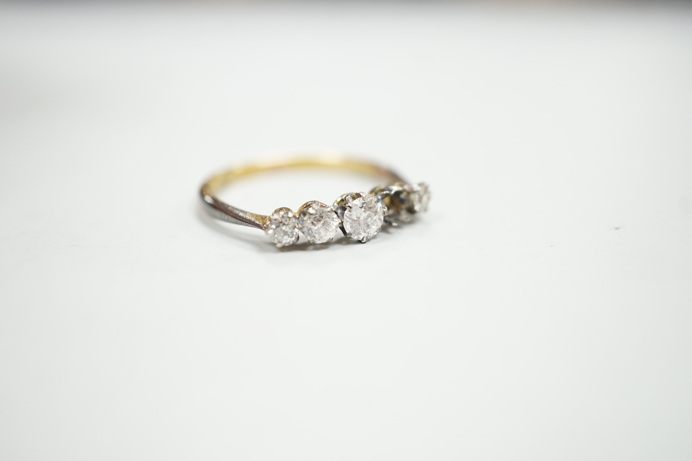 An 18ct and graduated five stone diamond set half hoop ring, size P, gross weight 1.9 grams, one - Image 3 of 4