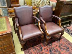 A pair of reproduction mahogany Gainsborough style library chairs, width 68cm, depth 70cm, height