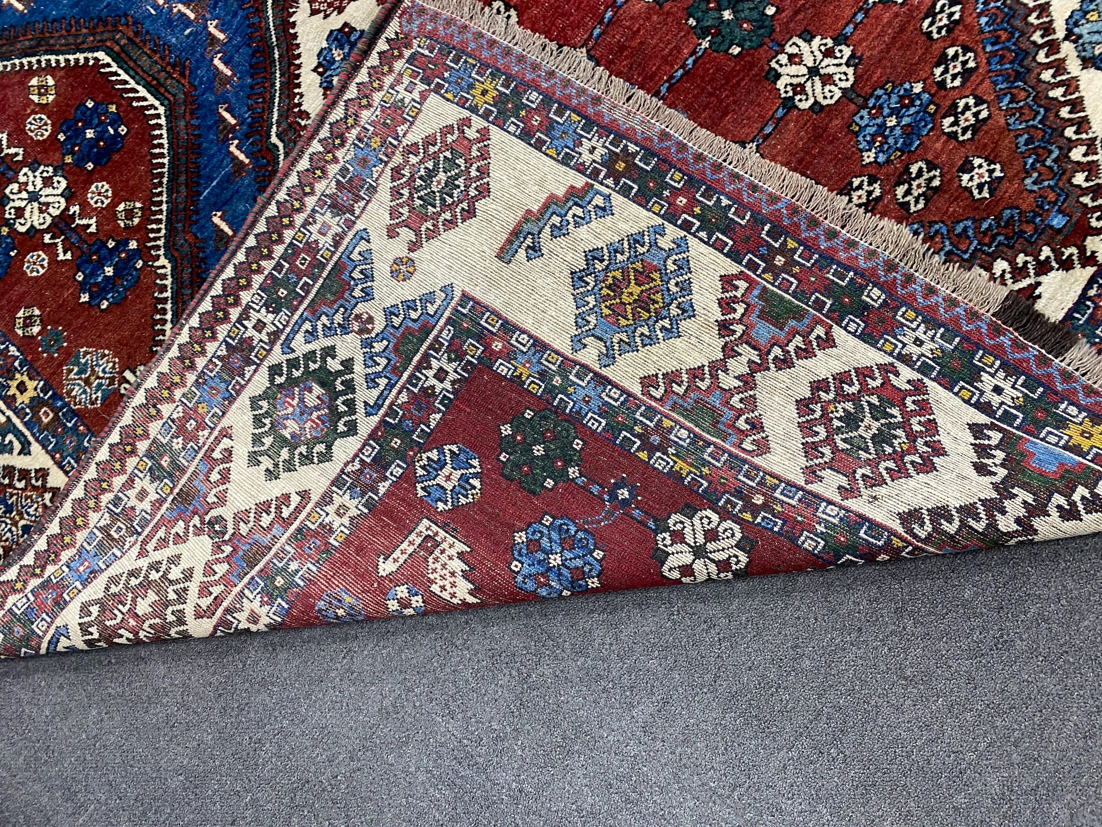 A Caucasian red ground carpet, 335 x 214cm - Image 4 of 4