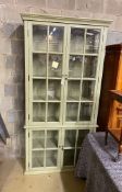 A large eau de nil painted display cabinet, width 116cm, depth 39cm, height 230cm