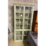 A large eau de nil painted display cabinet, width 116cm, depth 39cm, height 230cm