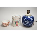 A 19th century Chinese famille rose cylindrical jar and cover, 11.5cm high, a blue and white