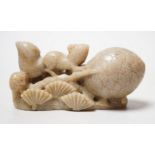 A Chinese carved soapstone carving of a squirrel and pine cone 8.5cm