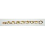 An early 20th century yellow metal and shell set bracelet (clasp shell missing), approx. 18cm, gross
