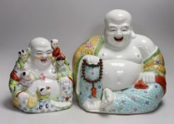 Two Chinese porcelain enamelled Budai figures, tallest 29cms high