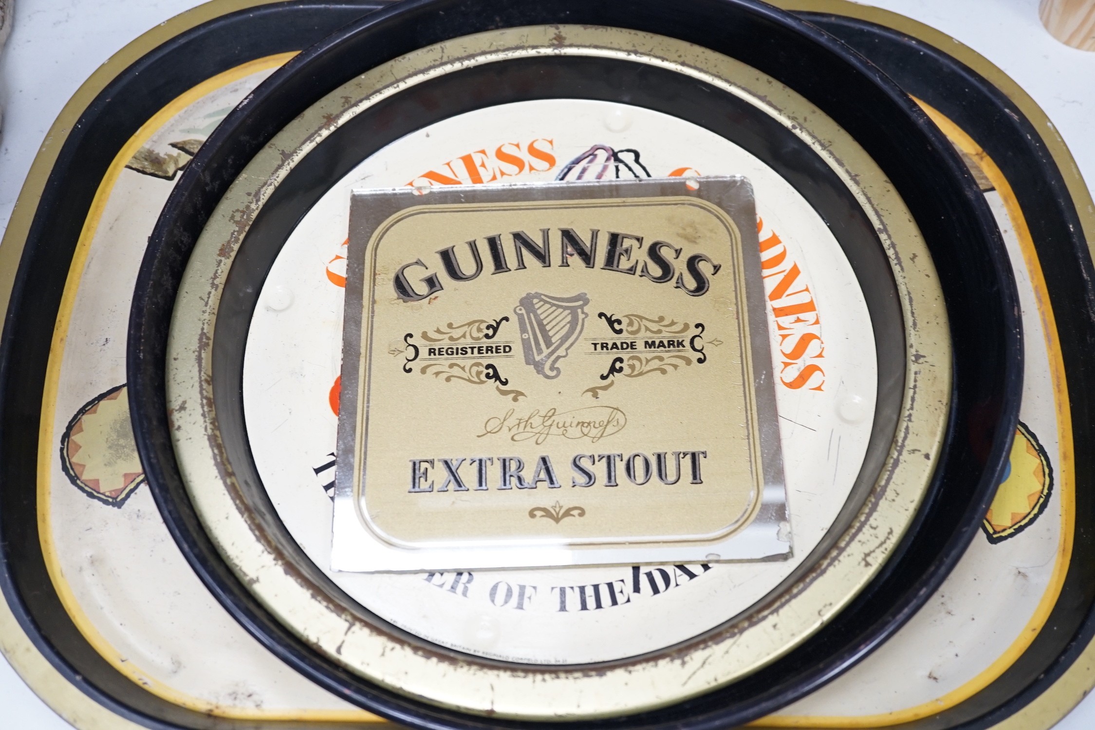 Five Guinness advertising signs, mirror, trays and a book - St. James’s Gate Brewery History and - Image 5 of 5