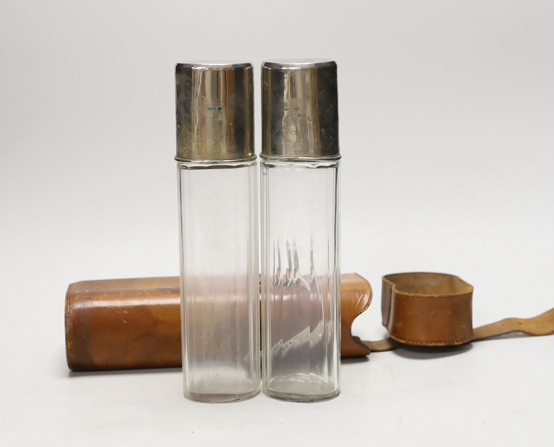 A late 19th/early 20th century leather duo travelling flask case by A. Greaves with two flasks