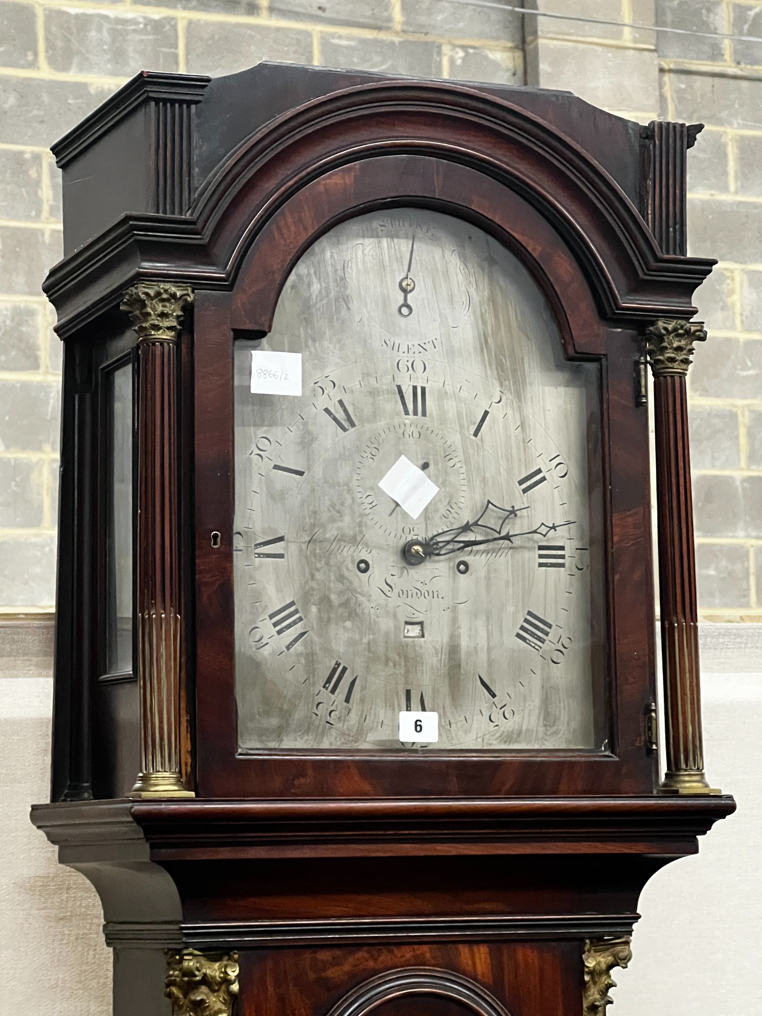 A George III mahogany 8 day longcase clock, the 12in arched silvered dial, marked Charles Bright,