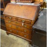 An 18th century feather banded walnut bureau, width 92cm, depth 51cm, height 108cm