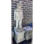 A reconstituted stone garden pierrot on square plinth, height 130cm *Please note the sale