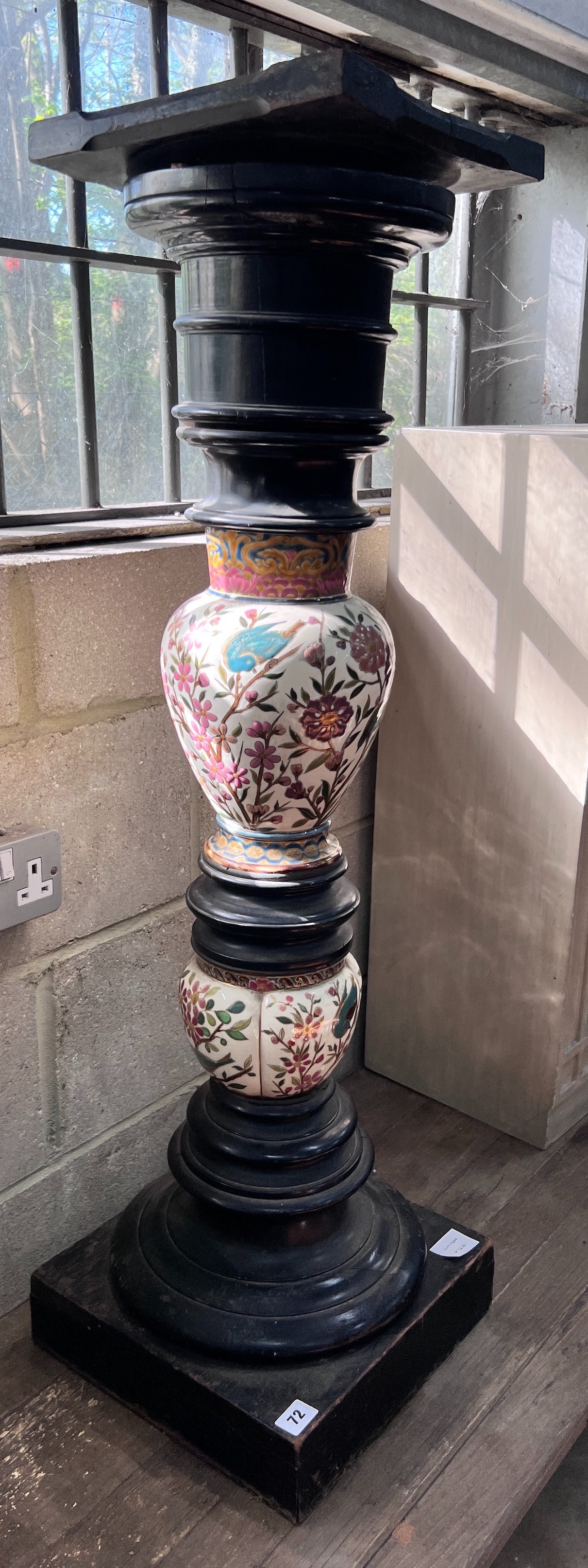 A 19th century ebonised porcelain mounted pedestal, height 105cm *Please note the sale commences