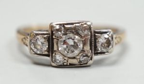 An early 20th century yellow metal and diamond cluster set ring, size K, gross weight 2 grams.