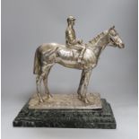 A Elkington & Co. silver plated model of a horse and jockey, on marble base, 34cms high