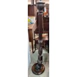 A carved oak and mahogany carved standard lamp, height 151cm *Please note the sale commences at