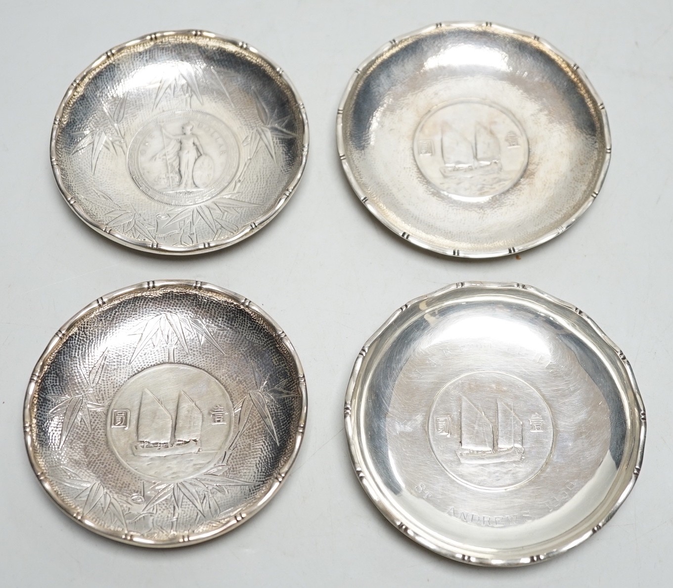 Three Hong Kong white metal mounted Republic of China coin dishes and a similar One Dollar 1930