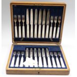 A cased set of twelve pairs of George V mother of pearl handled silver dessert eaters, Isaac Ellis &