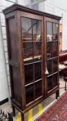 A George III mahogany glazed two door bookcase, width 112cm, depth 38cm, height 188cm*Please note