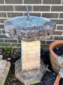 An octagonal reconstituted stone sundial on brick effect pillar, height 75cm *Please note the sale