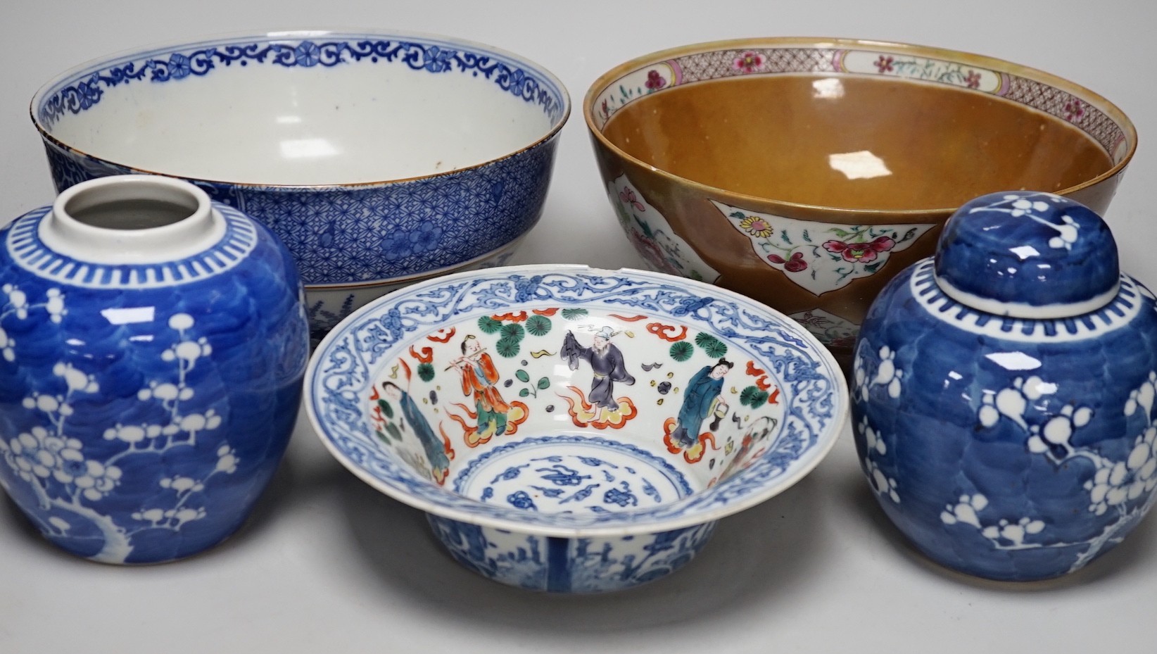 A group of Japanese and Chinese ceramics to include two blue and white jars, a wucai bowl etc.