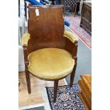 A stylish Art Deco mahogany elbow chair by Trollope and Son, numbered 4088, height 95cm *Please note