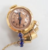 A lady's 1930's/1940's yellow metal and blue cabochon set lapel clip watch, 25mm, gross weight 9.5