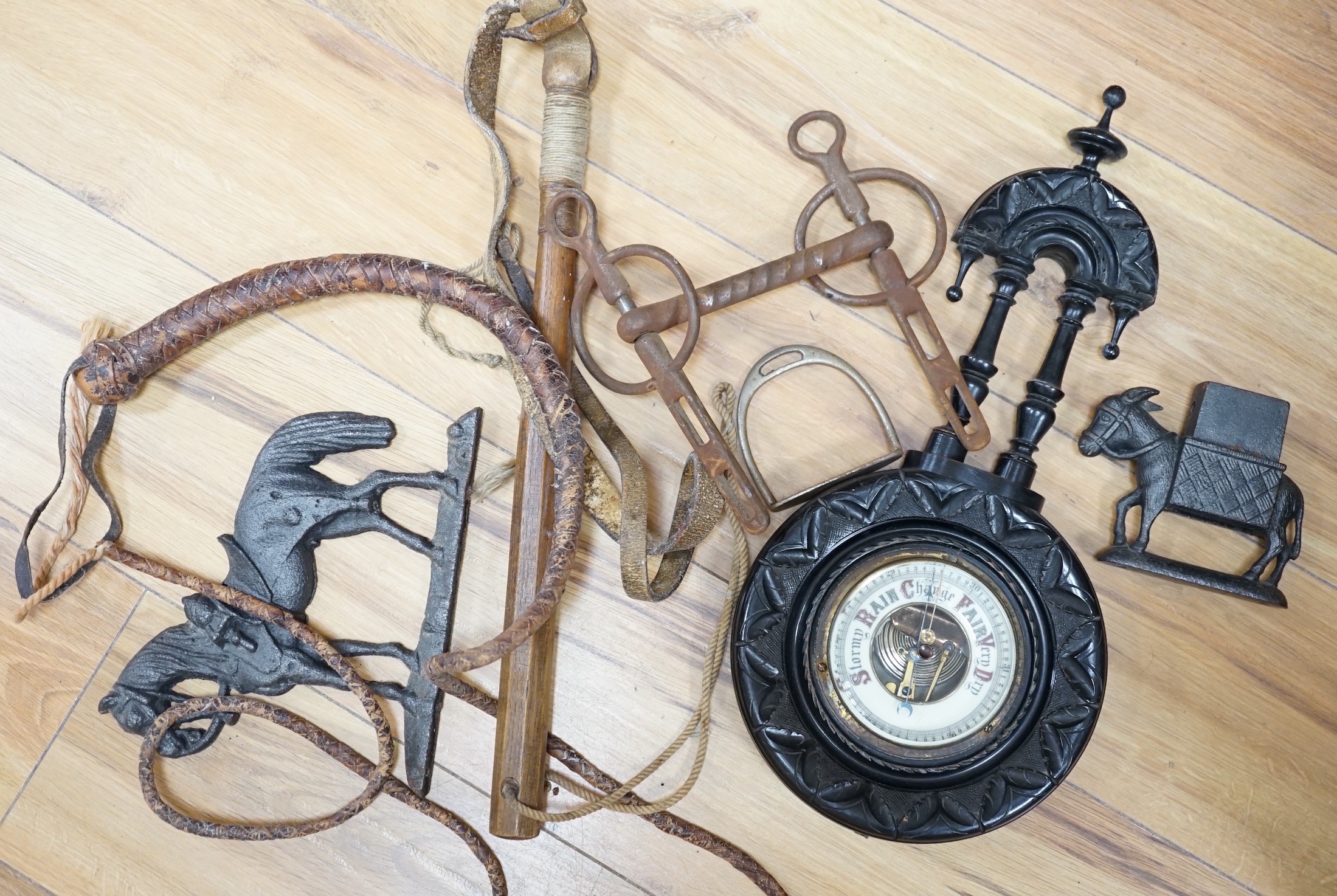 Assorted horse accessories, iron castings, a Disraeli plaque, etc