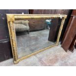 A Victorian gilt gesso and carved wood wall mirror, with vineous scroll borders, width 141cm, height