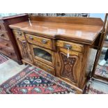 A late Victorian carved walnut breakfront sideboard, length 153cm, depth 52cm, height 107cm *