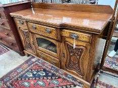 A late Victorian carved walnut breakfront sideboard, length 153cm, depth 52cm, height 107cm *