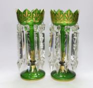 A pair of Victorian green glass gilt decorated table lustres, 32cm high