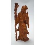 An early 20th century Chinese carved boxwood figure of Shou Lao, 26cm