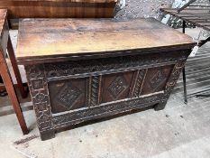 An 18th century and later carved oak coffer, width 108cm, depth 54cm, height 66cm *Please note the