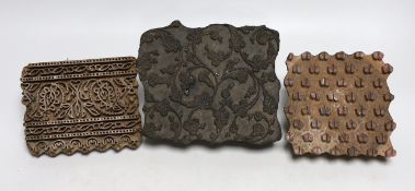 Three wooden patterned printing blocks, largest 18cm wide x 16m high