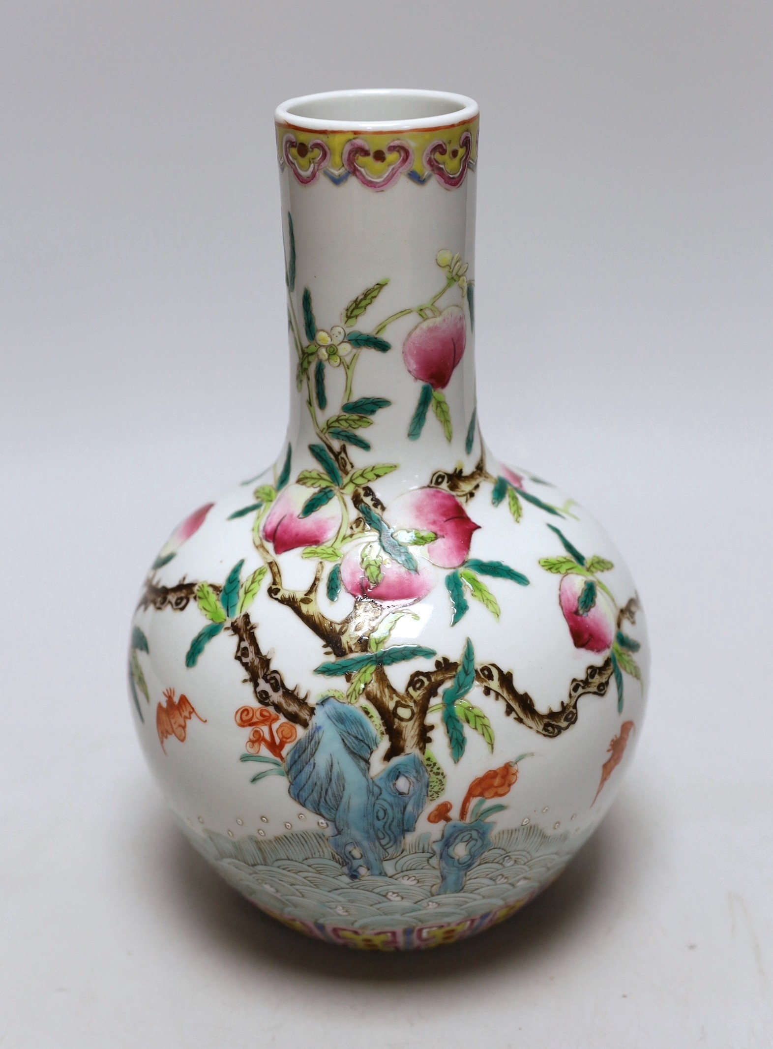 A small Chinese peach decorated bottle vase, 23cm high