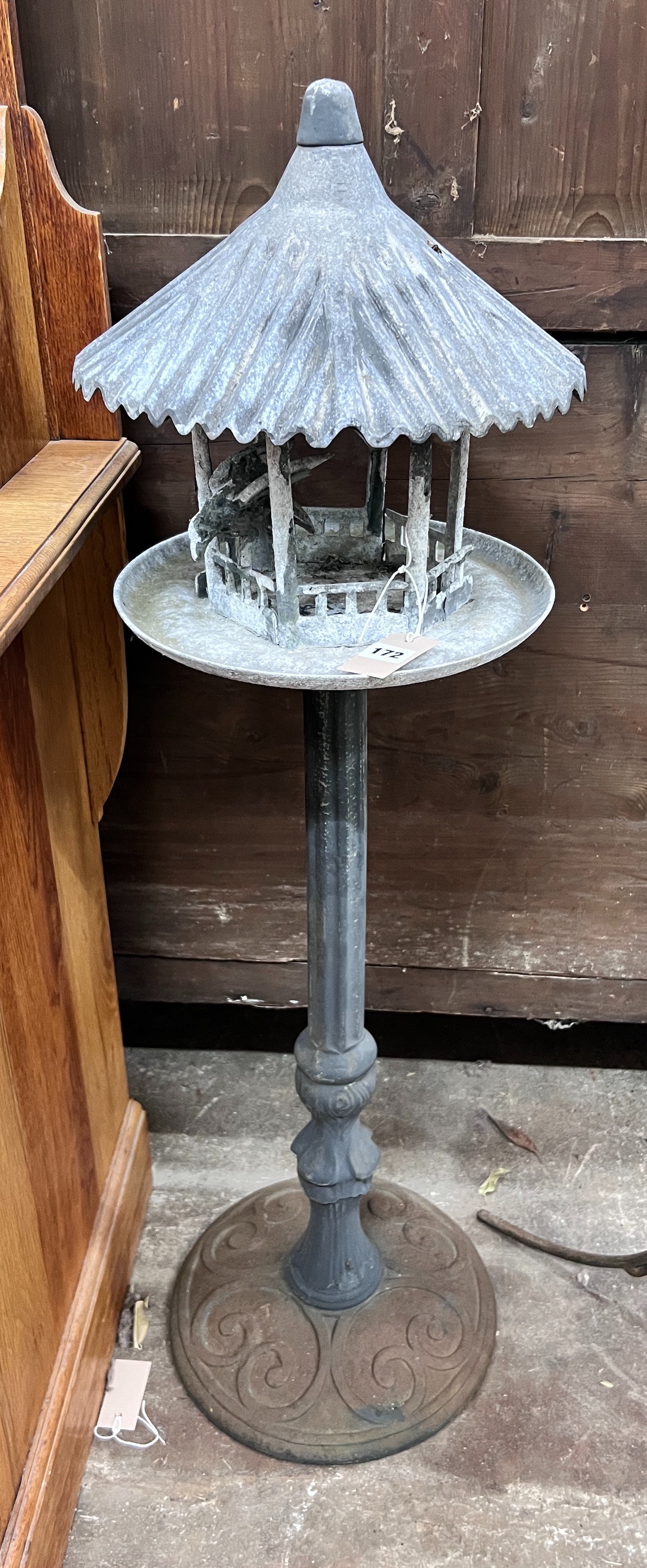 A cast iron and galvanised metal garden lantern / bird table, height 110cm *Please note the sale