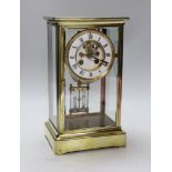 A late 19th century brass and four glass mantel clock, 30cm high