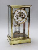 A late 19th century brass and four glass mantel clock, 30cm high