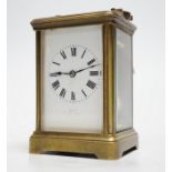 A striking carriage clock, 12cm tall