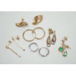 Two modern pairs of 375 earrings, a pair of 9ct, emerald and diamond set drop earrings and a pair of
