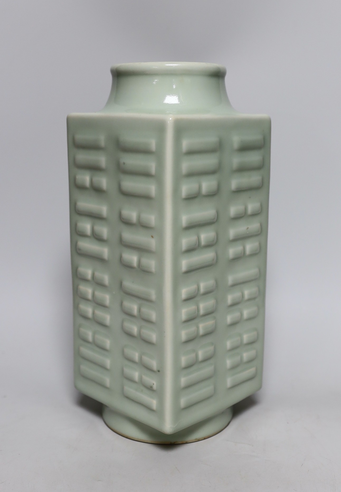 A square Chinese celadon-glazed 'cong' style vase, 30cm tall