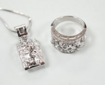 A modern 750 white metal and diamond cluster set dress ring, size N and a matching pendant necklace