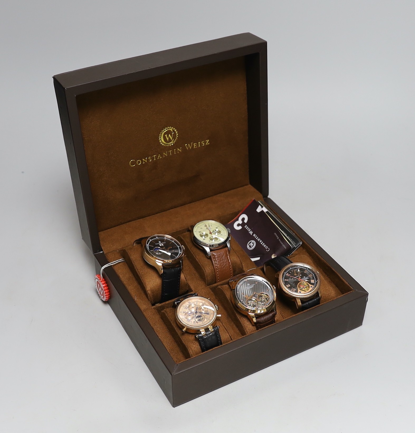 Five gentleman's assorted modern steel or gilt metal Constantin Weisz wrist watches including