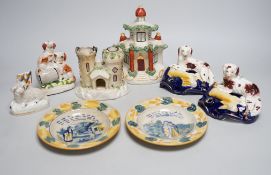 A pair of 19th century Staffordshire King Charles Spaniel pen holders and two pearl ware plates
